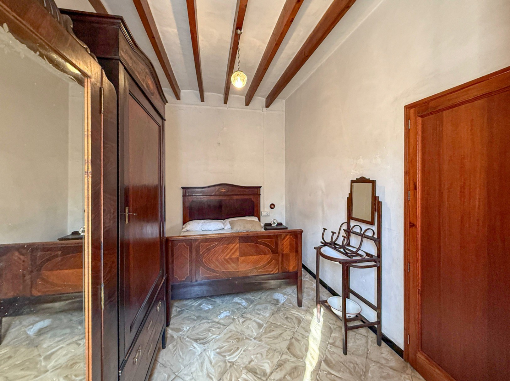 Spacious Duplex House in Llubí with Patio, Garage, and Potential for Upgrades