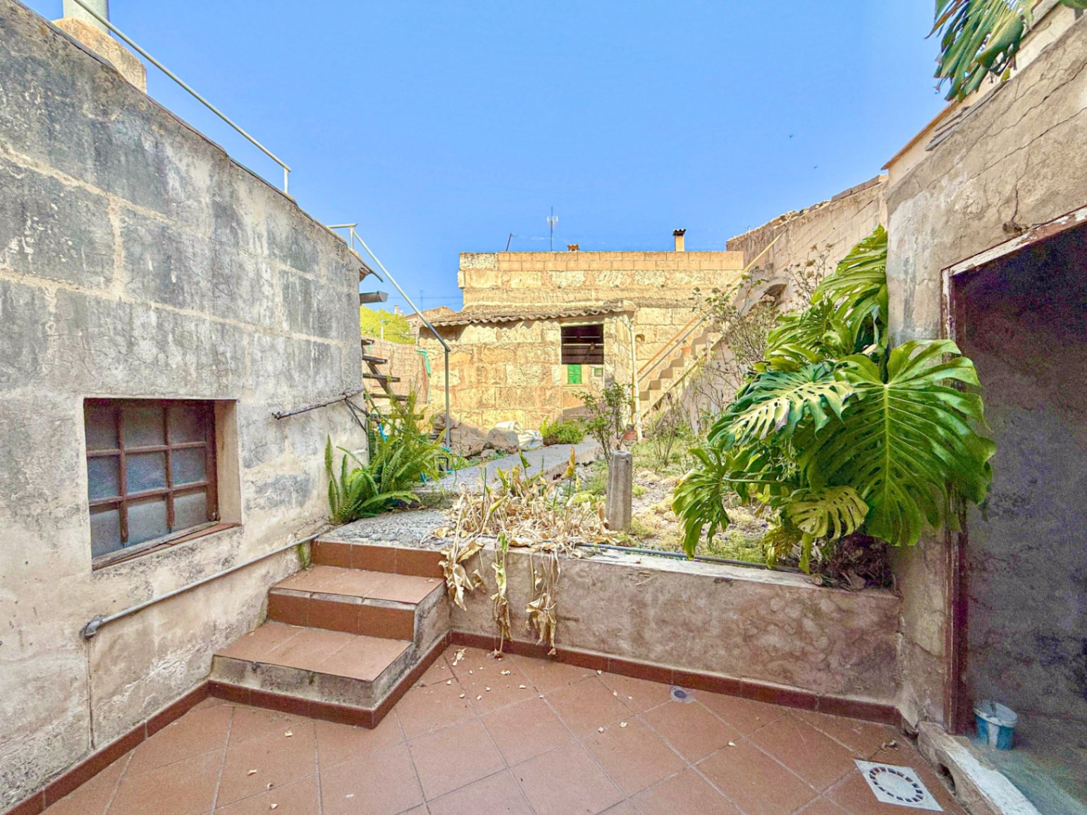 Spacious Duplex House in Llubí with Patio, Garage, and Potential for Upgrades
