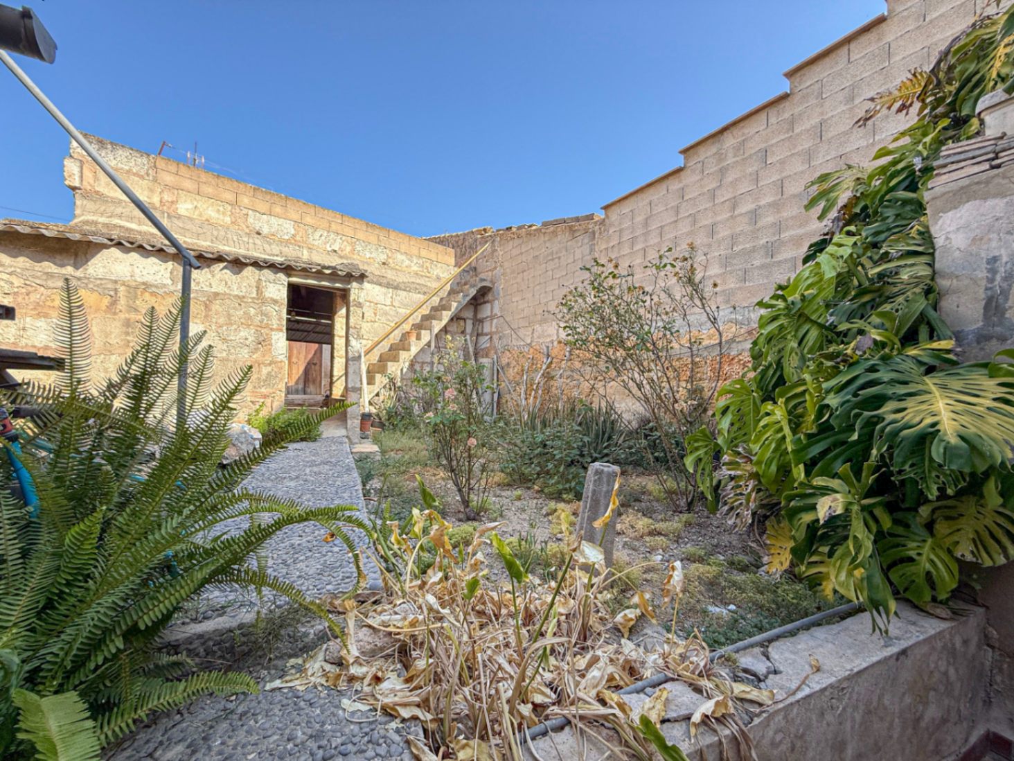 Spacious Duplex House in Llubí with Patio, Garage, and Potential for Upgrades