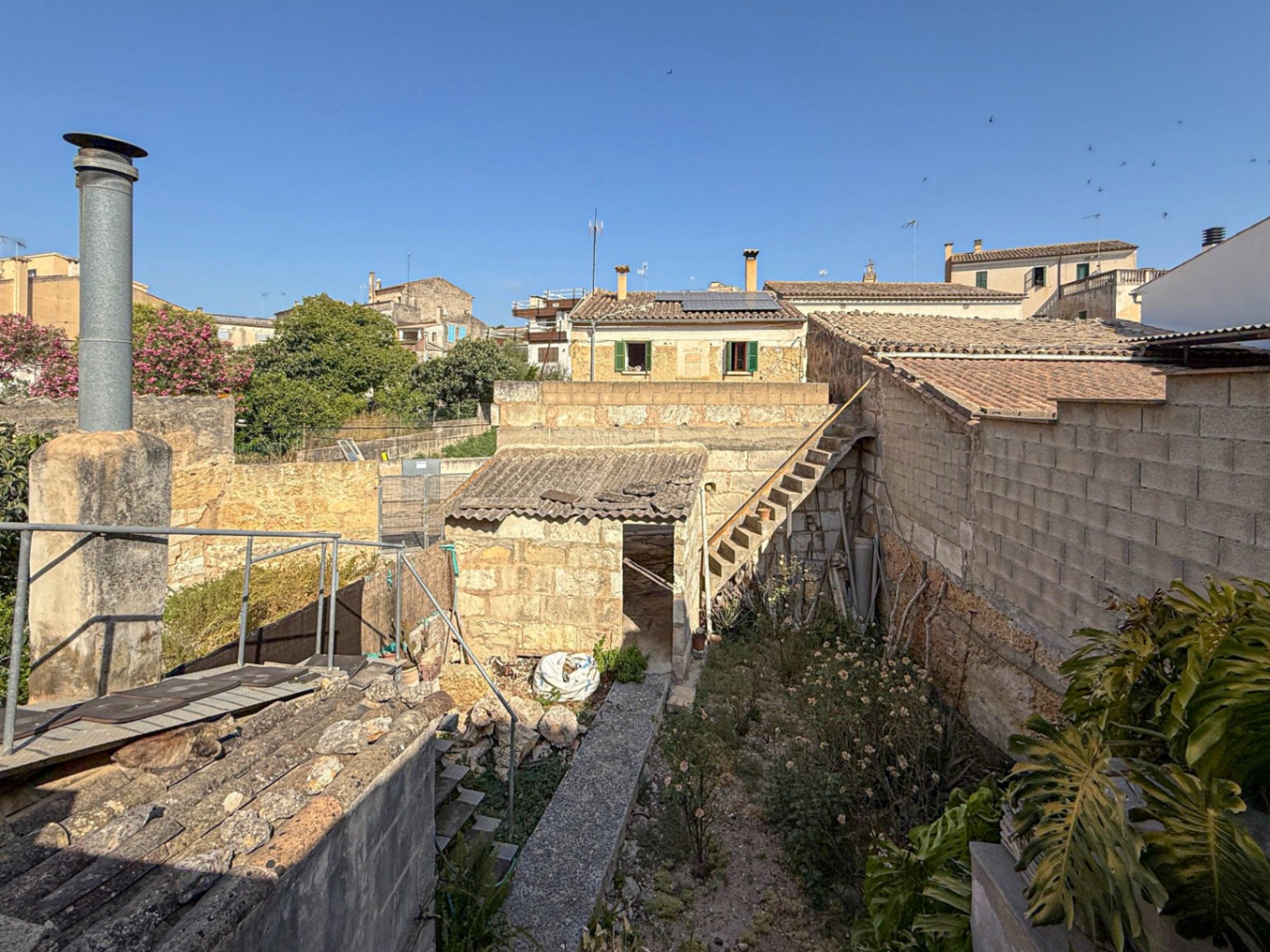 Spacious Duplex House in Llubí with Patio, Garage, and Potential for Upgrades