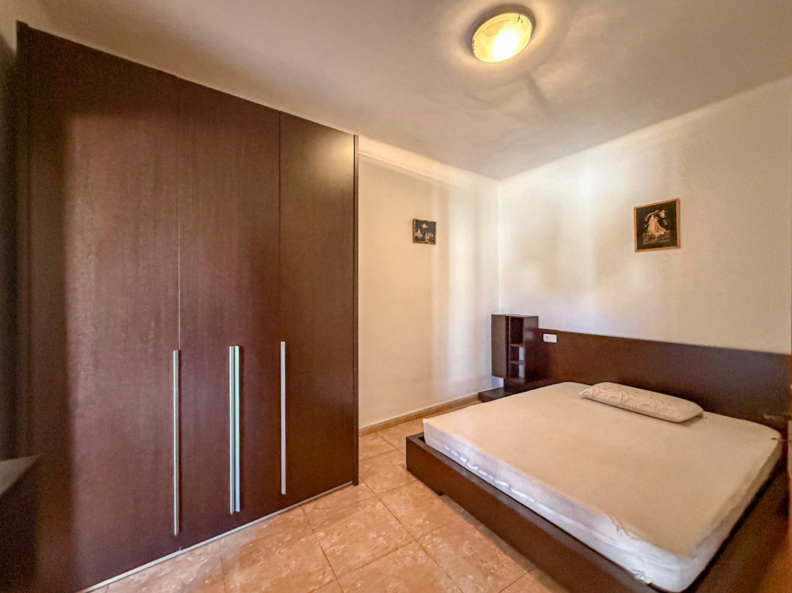 Spacious Duplex House in Llubí with Patio, Garage, and Potential for Upgrades