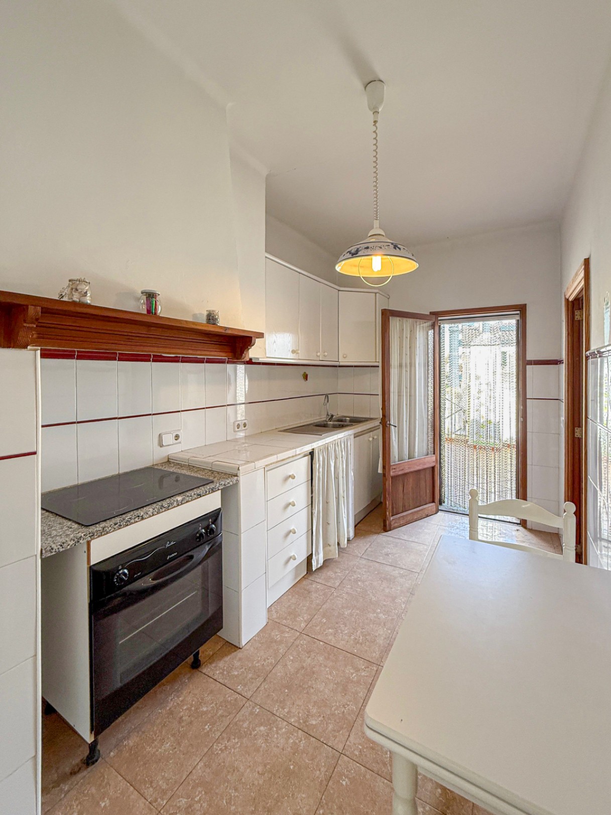 Spacious Duplex House in Llubí with Patio, Garage, and Potential for Upgrades