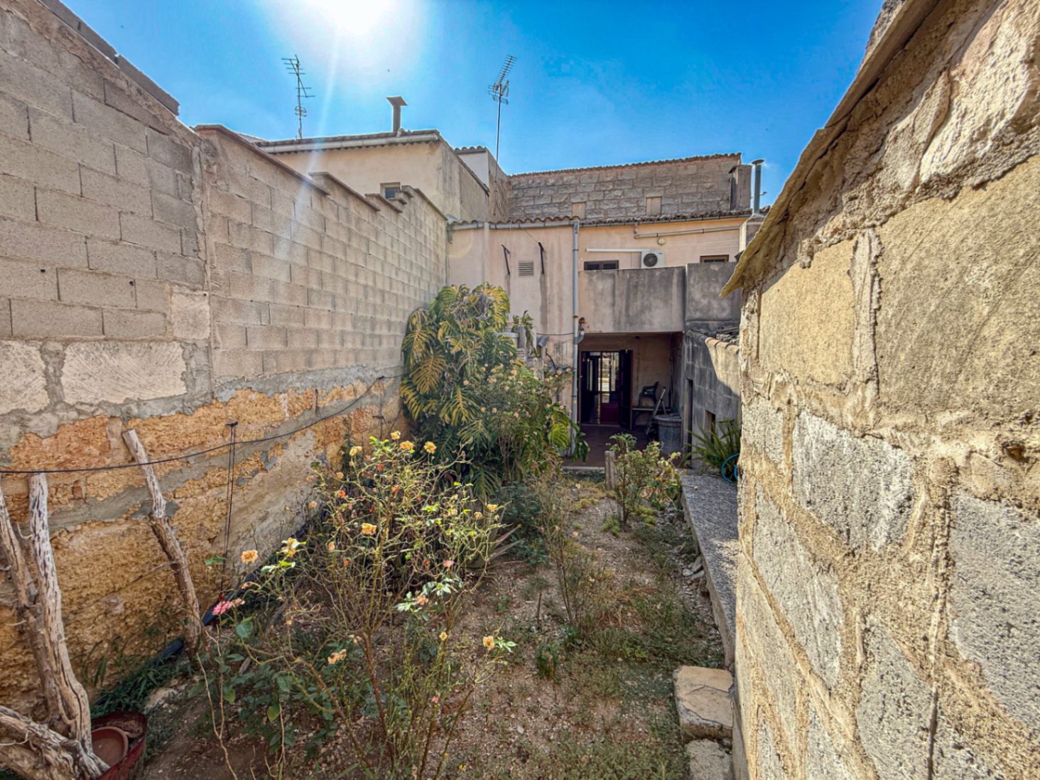 Spacious Duplex House in Llubí with Patio, Garage, and Potential for Upgrades