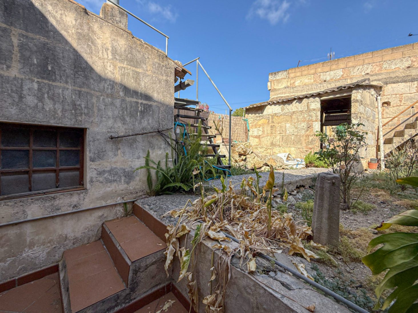 Spacious Duplex House in Llubí with Patio, Garage, and Potential for Upgrades